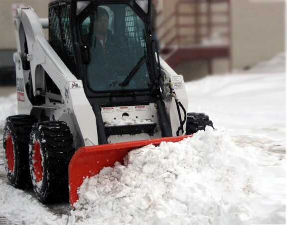 Bobcat moving snow