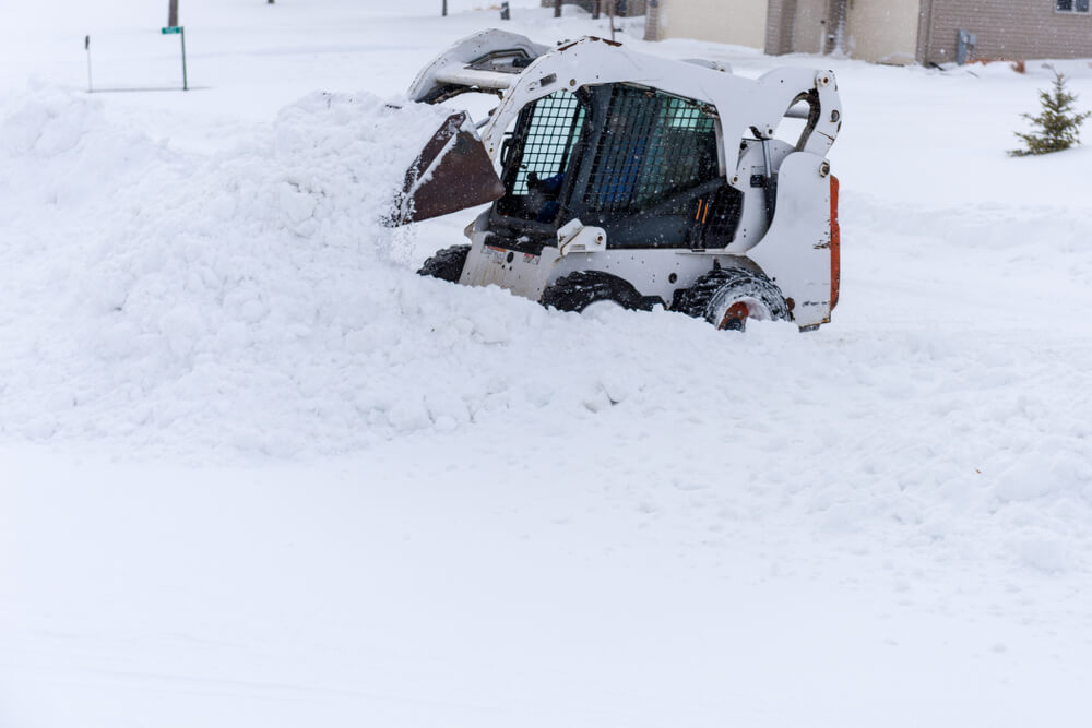 bobcat skid steer in snow